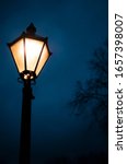 Small photo of Lamp post in the dark. The parks of London at night can have that mysterious feel and this picture aims to emphasise this atmosphere.