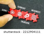 red puzzle connection with STEM icon. science, technology, engineering, mathematics education word with icons