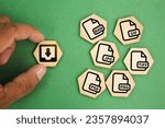 Small photo of wooden hexagon with save file icon or download file format JPEG, PNG, GIF, TIFF, PSD And RAW file. files are saved into folders. Concept document management system or DMS. Highest Quality Image Format
