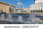 Small photo of Genova, Italy. View of Piazza Raffaele de Ferrari, with the fountains in the foreground. On the left the Doge's Palace. In the background the building of the Carlo Felice Opera House. 2023-10-06.