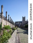 Small photo of Wells, Somerset, UK 08 25 2021 Houses on Vicar's Close and Wells Cathedral in Somerset in the UK