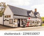 Small photo of Westleton, Suffolk, UK. May 3rd 2023. View of a traditional village shop and tea room. Westleton Village Stores and The Snug Tea Room.