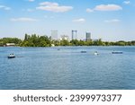 Small photo of Bucharest, Romania - August 15 2023: Many people in boats paddling on the lake in King Mihai I park (Herestrau). Couple on a romantic gateaway.