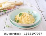 Creamy Brie cheese Risotto on sage broth, light background 
