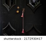 Black wooden door with glass...