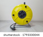 Industrial Four Socket Extension Cable Reel 50 Meters Long On Parquet Floor