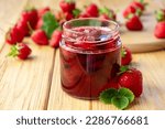 Small photo of Strawberry jam in glass jar on wooden board with fresh strawberry fruit and green leaves on wooden background. Recipe of delicious homemade berry jam of strawberry full of vitamins and antioxidants.