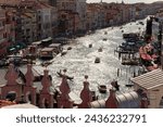Small photo of Venice, Italy - Sept.22, 2023: Venice's Grand Canal and other waterways are filled with a wide variety of water traffic including iconic gondolas, sleek motorboats, vaporetto water busses and ferries.