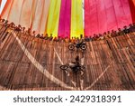 Small photo of Bogura, Bangladesh - May 15, 2022 - Daredevil motorcyclists ride around a steep 'wall of death' at 50 miles an hour with pillion behind