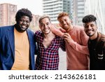 Small photo of Diverse trendy group of friends having fun outdoor - Diversity and multiracial people - Focus on non-binary gay man