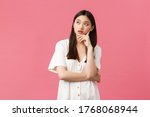 Small photo of Beauty, people emotions and summer leisure concept. Annoyed and exhausted asian girl eye roll, looking away and exhale irritated, feeling bothered by someone, pink background