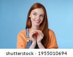 Small photo of Devious tricky smart pretty redhead girlfriend have evil plan smirking mysteriously look upper left corner twiddles fingers think excellent plan, smiling delighted, standing blue background