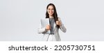 Small photo of Business, finance and employment, female successful entrepreneurs concept. Confident good-looking therapist or businesswoman in white suit, holding laptop and showing thumbs-up