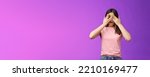 Small photo of Shocked concerned asian girl witness terrible crime feel insecure scared, close eyes frightened shook, open mouth, gasping upset, standing stupor drop jaw, pose purple background