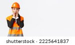 Small photo of Shocked and concerned asian female engineer having problem at building area, stare at project astounded with panic face, holding hands near mouth and gasping worried, standing white background.