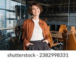 Small photo of Portrait of young confident woman, start-up manager in office, posing with confidence, looking self-assured, wearing casual, informal clothes.