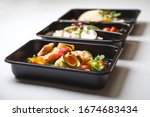 Catering food with healthy balanced diet delicious lunch box gastronomy boxed take away deliver packed ready meal in black container restaurant inn dinner, meal, brakfast