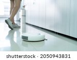 White Robot vaccum automatic cleaner is the best solution for a cleaning on tiled floor in the office, it is safe time for housekeeping and lady officer and it can clean a space under the lockers 