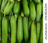 Small photo of Macro photo green cucumbers. Stock photo food vegetable fresh cucumbers