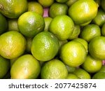 macro photo green citrus limes. ... | Shutterstock . vector #2077425874