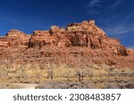 dramatic red rock formations   on a sunny winter day   in the san rafael river canyon along the buckhorn draw scenic byway in the northern san rafael swell near green river,  utah 