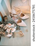 Small photo of ISTANBUL, TURKEY - MARCH 17, 2023: The Chloe brand perfume, bridal shoes, bouquet, and solitaire engagement ring are displayed decoratively in the bridal suite pre-wedding.