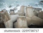 Small photo of A breakaway, from concrete mold on the beach, pemecah gelombang laut, pemecah ombak laut, di pantai, dari bahan beton bentuk segitiga diagonal, cetakan beton, pantai glagah, mengurangi hantaman ombak