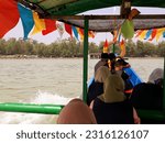 Small photo of The people is riding the boat on the beach. Indonesia, June 12, 2023, pengunjung wisata pantai widuri pemalang, sedang naik perahu nelayan dengan biaya ride a fishing boat, as a tourist destination