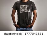 Black Lives Matter T-Shirt. Person Wearing BLM Tee Shirt Design on White Background.