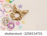 Set of baby girl hair accessories. Fashion hair bows, hair clips, hairpins and hair elastics.  Hairstyles for girls with stylish accessory. 