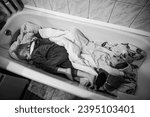 Small photo of Kyiv, UA, Ukraine - November, 26, 2023: Children are sleeping in a bathroom during air raid sirens