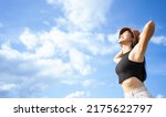Small photo of Satisfied tourist enjoying summer vacation and sun on the nature.Holiday tourist freedom woman showing armpit and deep breath.lady smile breathing fresh air with copy space lifestyle concept.