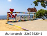 MANAUS written in big bright letters with colorful framing at Praia Ponta Negra, the Ponta Negra Beach, in the jungle metropolis Manaus in the heart of the Amazon rainforest of Brazil, South America