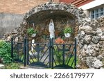 Small photo of Winona, Minnesota USA October 13, 2022 Grotto of Saint Bernadette seeing the vision of Our Lady of Lourdes at the Basilica of St. Stanislaus Catholic Church in Winona, Minnesota USA.