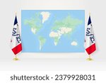 World Map between two hanging flags of Iowa on flag stand. Vector illustration for diplomacy meeting, press conference and other.