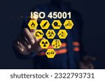 Small photo of Workplace safety officers point to the ISO 45001 safety standard for workplace safety such as methods, people, machines, materials and the environment. Safety work concept