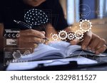 Small photo of A designer or developer puts brain knowledge of mathematics or physics on paper or notebooks before designing a product. Creating new innovation requires creativity and new ideas. sciencetist writing.