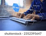 Small photo of Businessman working on laptop with ISO 9001 quality control and assurance to implement management system in global standard to improve productivity that certified by the auditor or certified body.