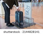Small photo of Weighing the luggage using a luggage measuring device at Incheon International Airport in April 2022