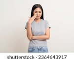 Small photo of Bad smell stinks. Young beautiful asian woman pinching nose with disgust. Holding breath with fingers on nose