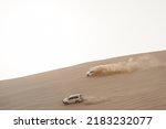 Small photo of INLAND SEA, QATAR - OCTOBER 13, 2017: Qatari men meet on the weekend in the emirate's south-eastern corner to practice dune bashing, a form of off-roading in the sand dunes.