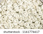 Many white roses are a top view. Vintage style.
