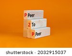 Small photo of P2P, peer symbol. Wooden blocks with concept words 'P2P, peer to peer'. Beautiful orange background, copy space. Business and P2P, peer to peers concept.