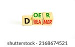 Small photo of Doer or dreamer symbol. Concept words Doer or dreamer on wooden cubes. Beautiful white table white background. Business and doer or dreamer concept. Copy space.