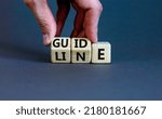 Small photo of Guideline symbol. Concept word Guideline on wooden blocks. Businessman hand changes words Guide on Line. Beautiful grey table grey background. Business and guideline concept. Copy space.