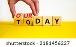 Small photo of Today is our day symbol. Businessman turns wooden cubes and changes concept words Today to our day. Beautiful yellow table white background, copy space. Business, motivation today is our day concept.