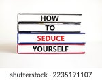 Small photo of How to seduce yourself symbol. Concept word How to seduce yourself on books. Beautiful white table white background. Business and how to seduce yourself concept. Copy space.