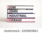 Small photo of DJIA Dow Jones industrial average symbol. Concept words DJIA Dow Jones industrial average on books on beautiful white background. Business DJIA Dow Jones industrial average concept. Copy space
