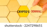 Small photo of Crypto downfall symbol. Concept words Cryptos downfall on wooden puzzles. Beautiful yellow table yellow background. Businessman hand. Business and crypto downfall concept. Copy space.