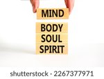 Small photo of Mind body soul spirit symbol. Concept words Mind Body Soul Spirit on wooden blocks. Beautiful white table white background. Businessman hand. Lifestyle mind body soul spirit concept. Copy space.